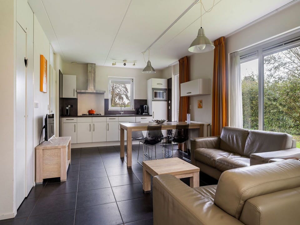 Couch, Table, Furniture, Property, Picture Frame, Living Room, Interior Design, Studio Couch, Floor, Flooring