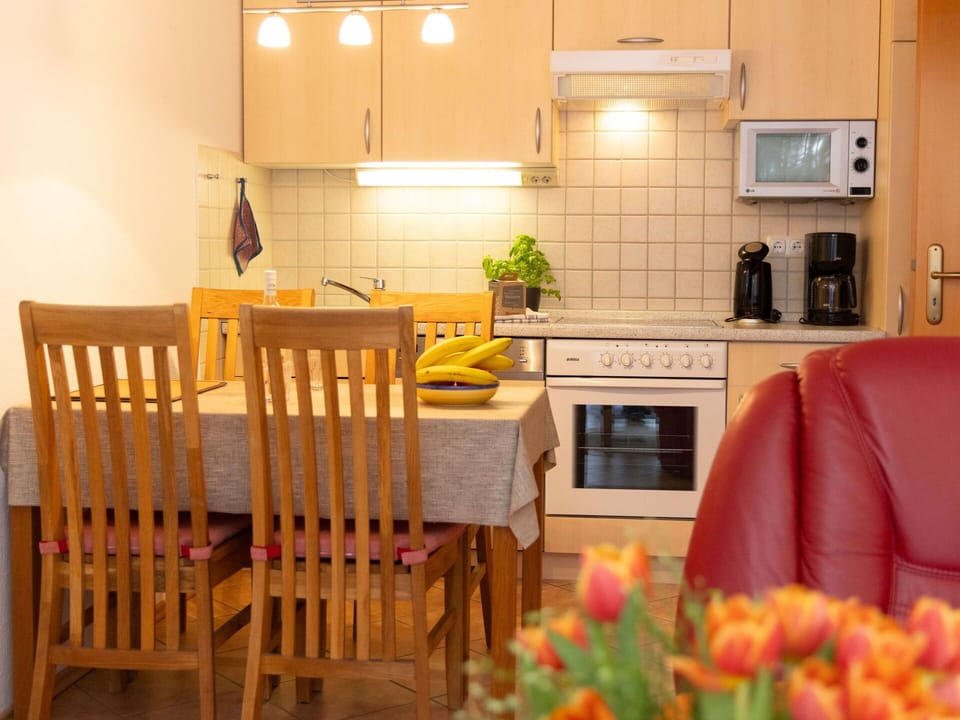 Furniture, Interior Design, Flooring, Wood, Kitchen, Floor, Room, Kitchen Appliance, Major Appliance, Lighting