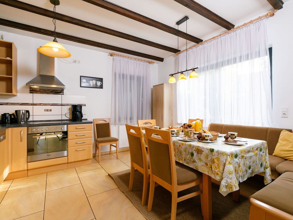 Table, Furniture, Property, Cabinetry, Countertop, Wood, Kitchen Stove, Interior Design, Lighting, Building