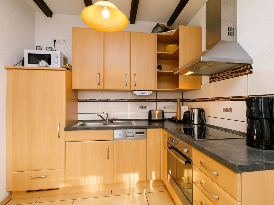 Cabinetry, Countertop, Property, Furniture, Building, Drawer, Kitchen Appliance, Kitchen Stove, Kitchen, Wood
