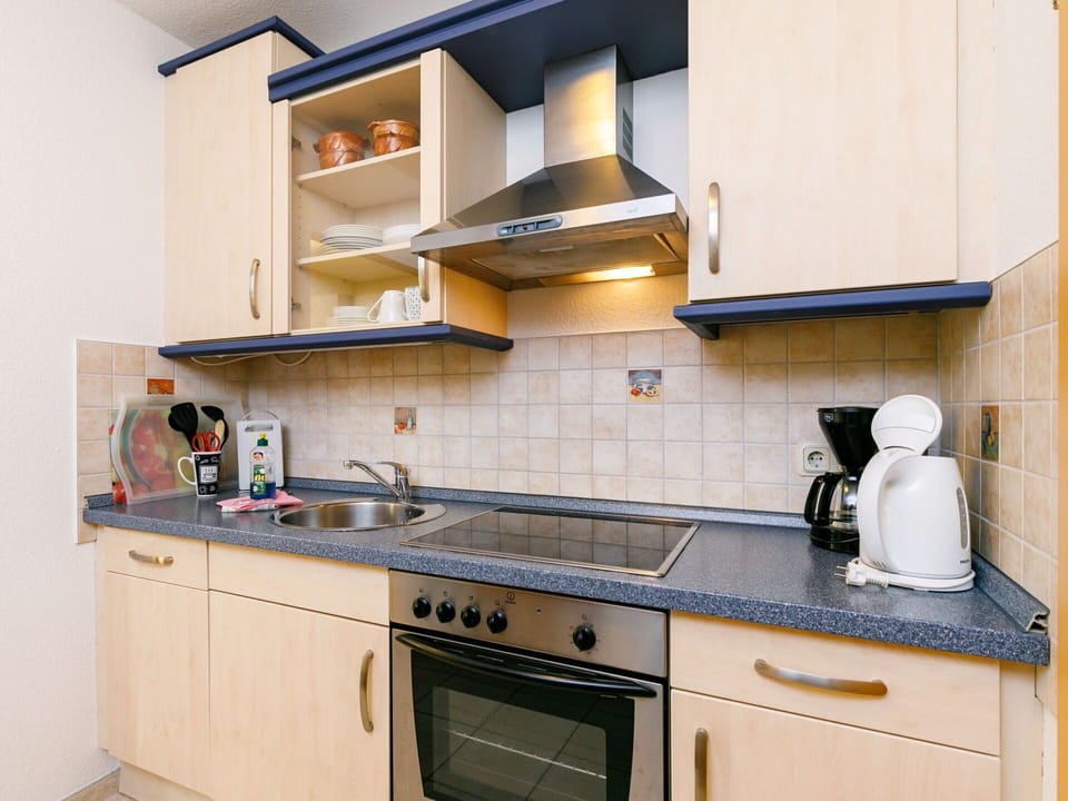 Cabinetry, Countertop, Property, Kitchen Stove, Kitchen, Kitchen Appliance, Building, Tap, Interior Design, Wood