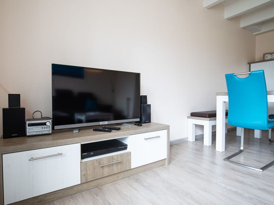 Furniture, Cabinetry, Television, Building, Television Set, Flooring, Floor, Living Room, Flat Panel Display