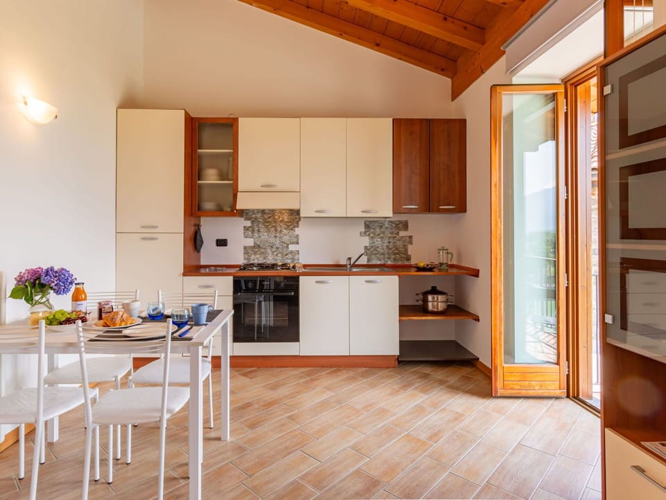 Cabinetry, Furniture, Countertop, Table, Wood, Flooring, Floor, Chair, Kitchen, Building