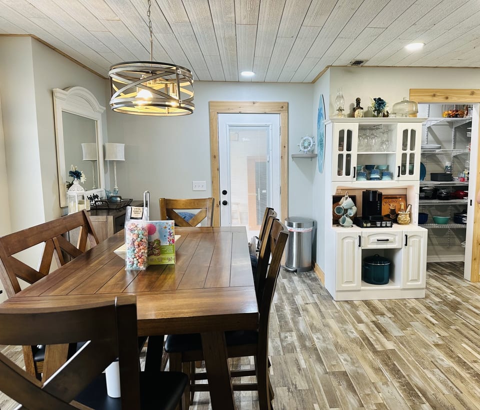Dining table w/two leaves to seat up to ten guests. More seating at counter bar