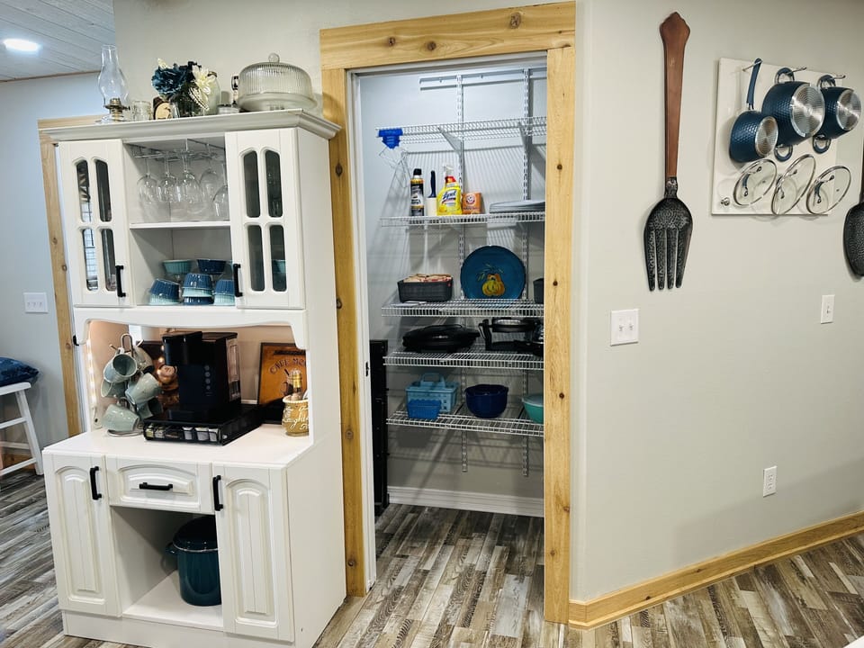 Coffee bar stocked w/ coffee supplies & hot cocoa. Large pantry w/misc gadgets