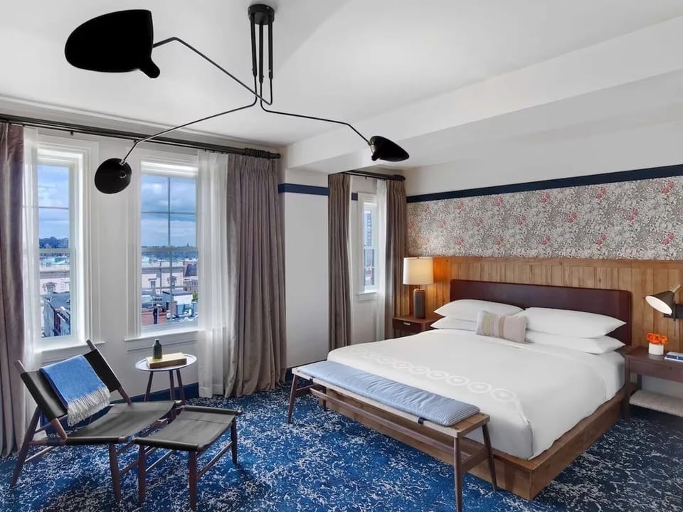 Wake up to skyline views in a sunlit king retreat
