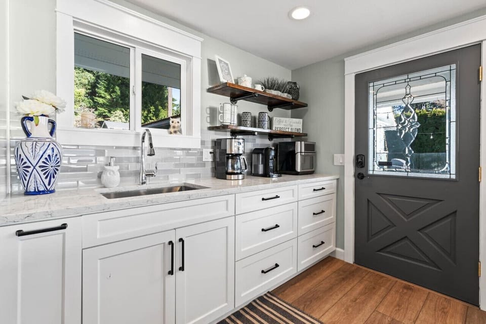 A second kitchen sink and side door to the patio.