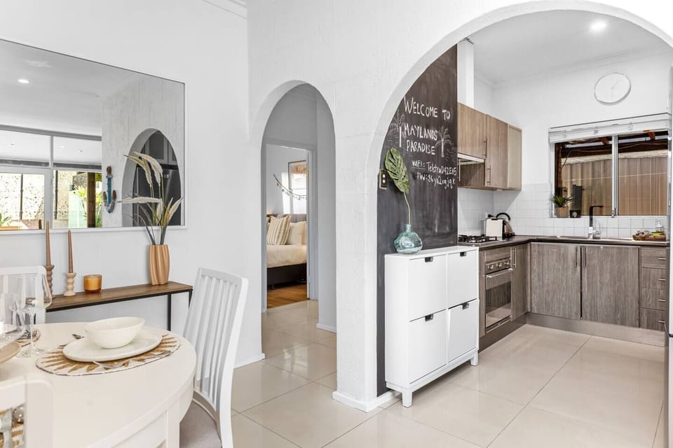 Bright and modern open-plan kitchen and dining area. Fully equipped kitchen, comfortable dining space, and easy access to the rest of your relaxing retreat.