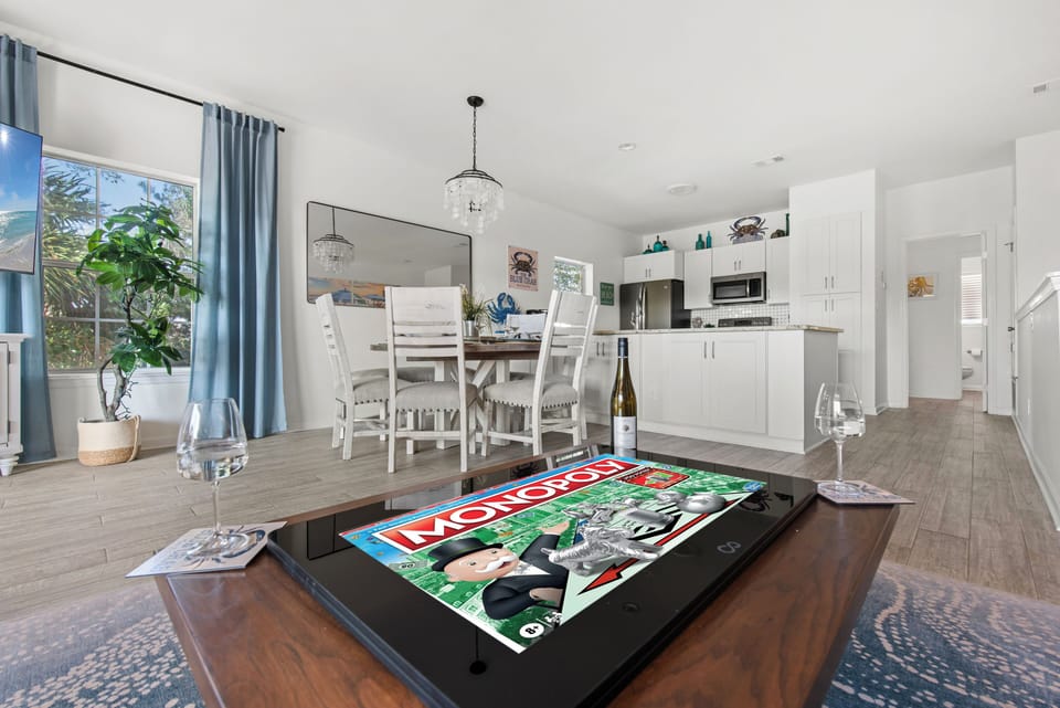 The spacious living room opens to the dining area and the kitchen.