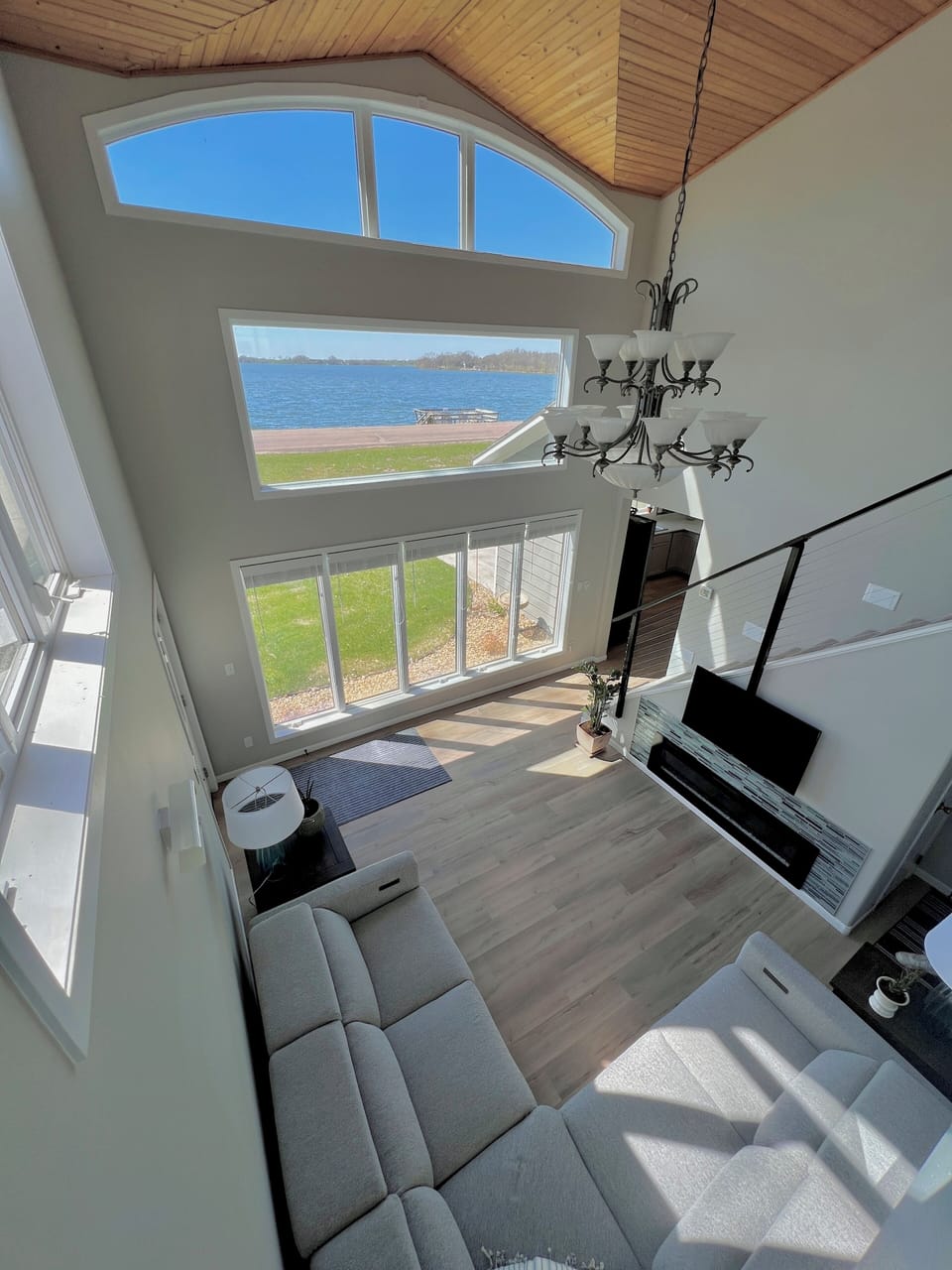 Spectacular views of the lake from the main floor or loft with these windows!