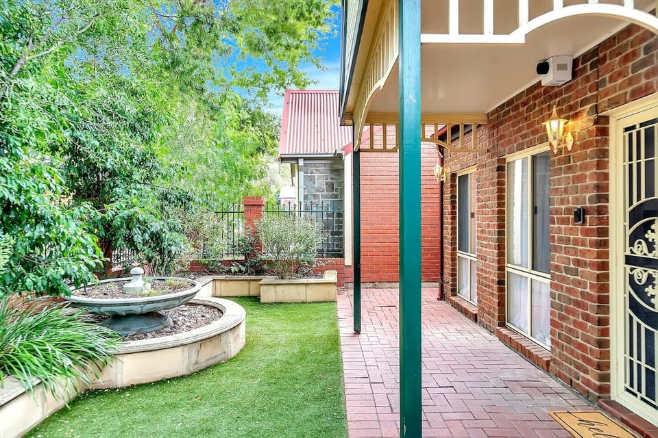 Step into the entrance and be greeted by lush greenery welcoming you home.