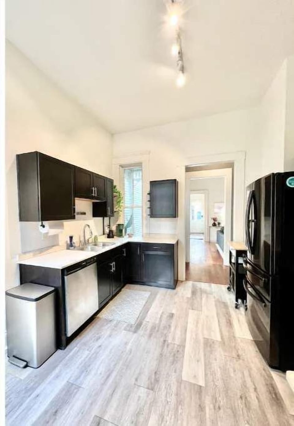 Fully stocked kitchen, with pull out butcher block cart for prep.