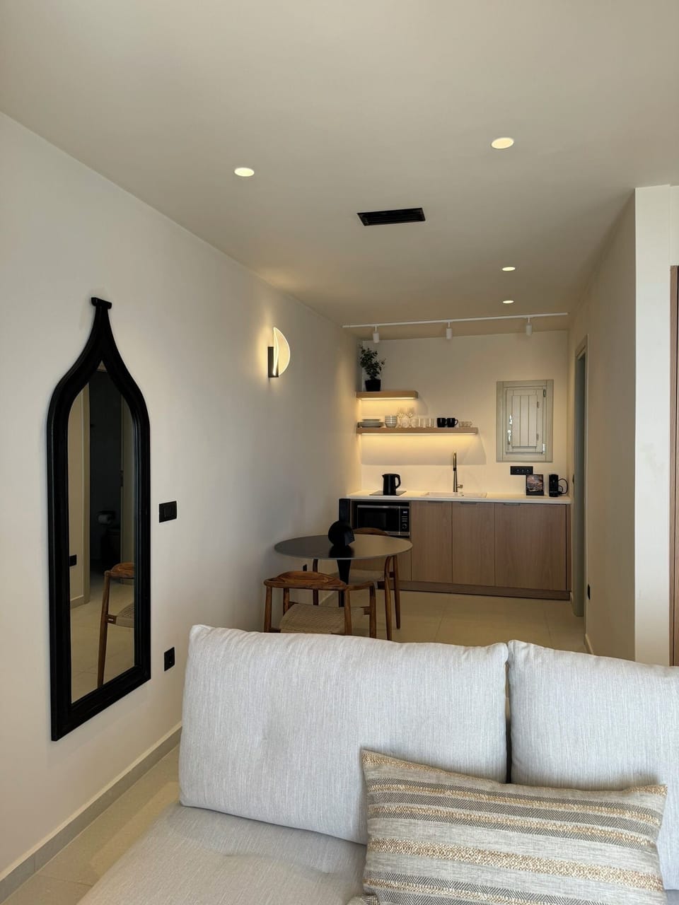 Living room and kitchenette on the back with dinning table.