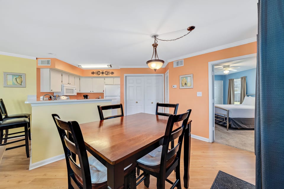 Gather around the 4-seater dining table for intimate meals and shared moments.