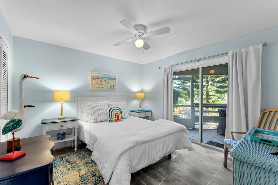 Second bedroom features queen bed, adjoining bathroom and smart tv