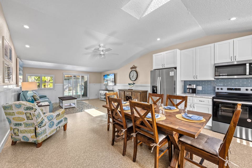 Bright, airy living space opens to the outdoors, inviting everyone to relax, connect, and soak in the Florida sun.