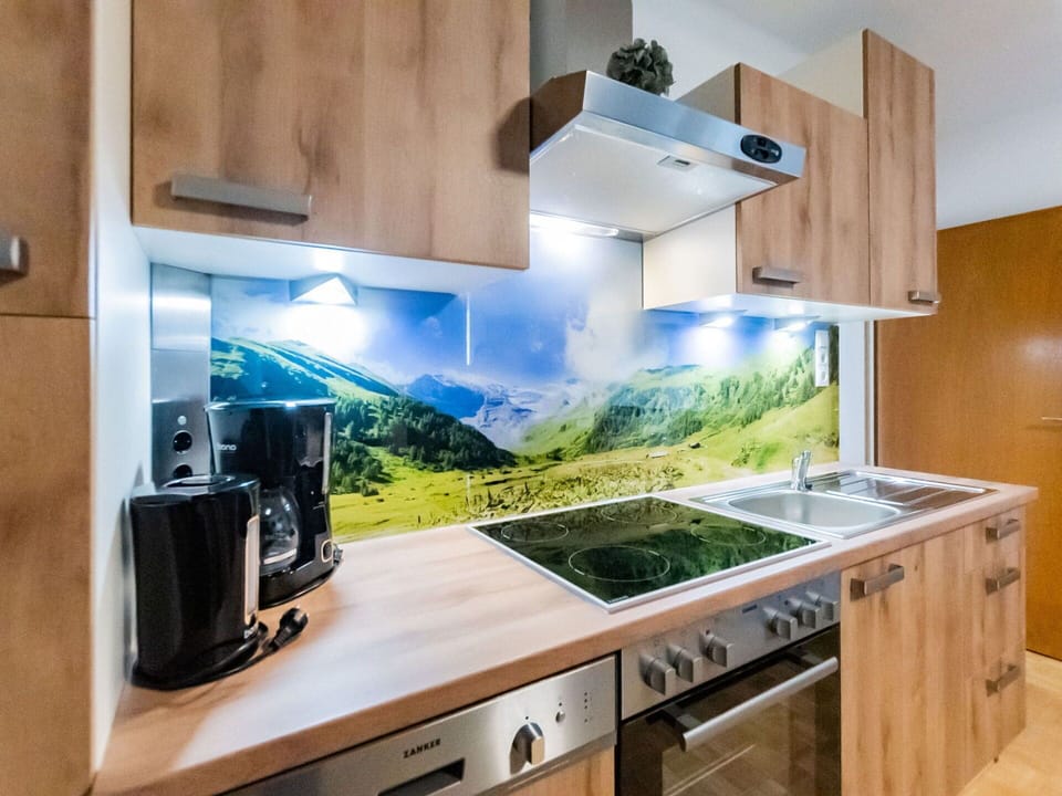 Countertop, Cabinetry, Property, Kitchen Appliance, Kitchen Stove, Kitchen, Microwave Oven, Home Appliance, Wood, Interior Design