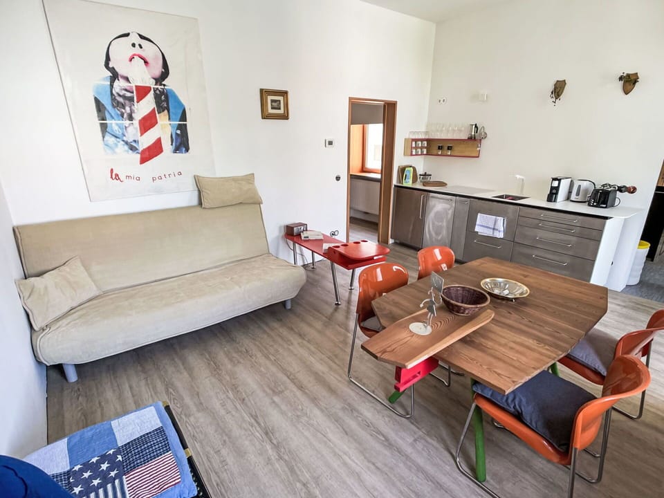 Furniture, Flooring, Interior Design, Wood, Floor, Table, Apartment, Room, Couch, Chair