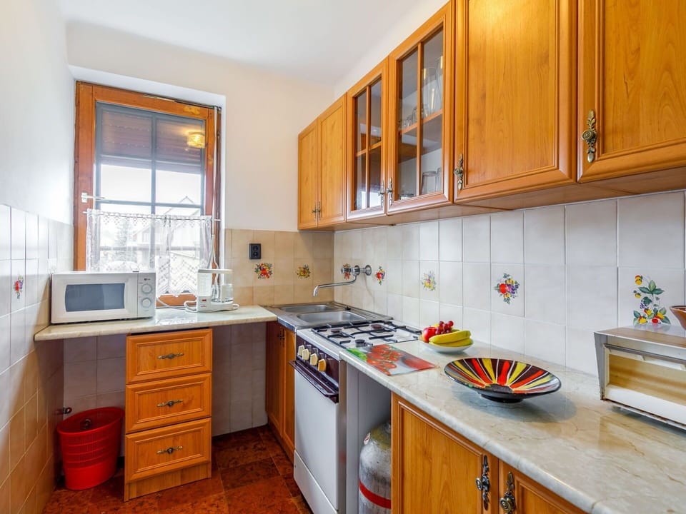 Cabinetry, Countertop, Property, Furniture, Sink, Kitchen Sink, Kitchen Stove, Kitchen, Kitchen Appliance, Building