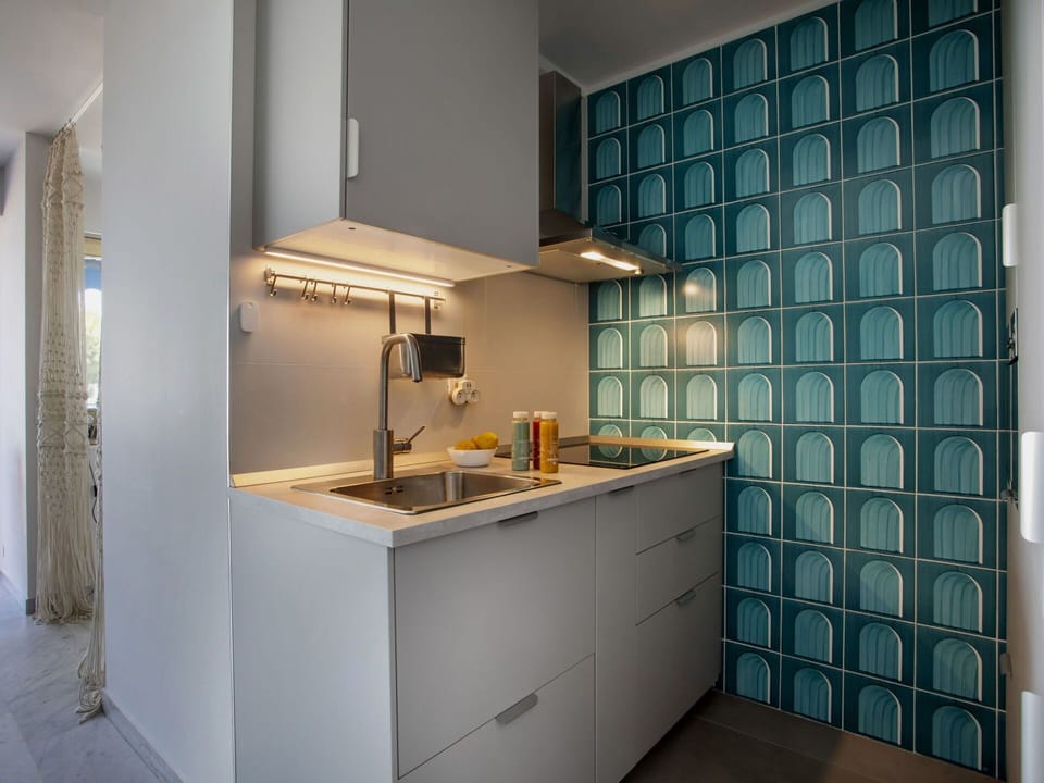 Kitchen, Interior Design, Countertop, Flooring, Plumbing Fixture, Floor, Kitchen Appliance, Cabinetry, Sink, Major Appliance