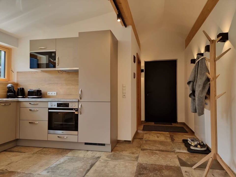 Cabinetry, Property, Countertop, Building, Wood, Kitchen Appliance, Lighting, Kitchen Stove, Interior Design, Drawer