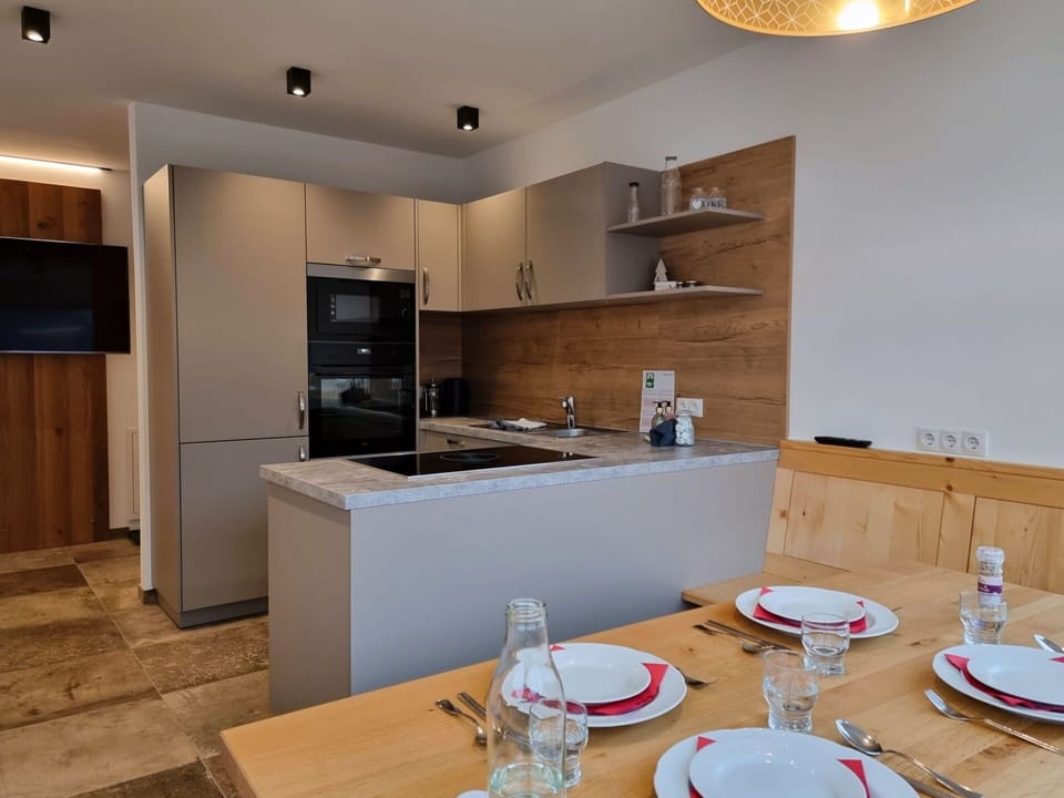 Table, Cabinetry, Property, Tableware, Furniture, Countertop, Lighting, Wood, Interior Design, Kitchen