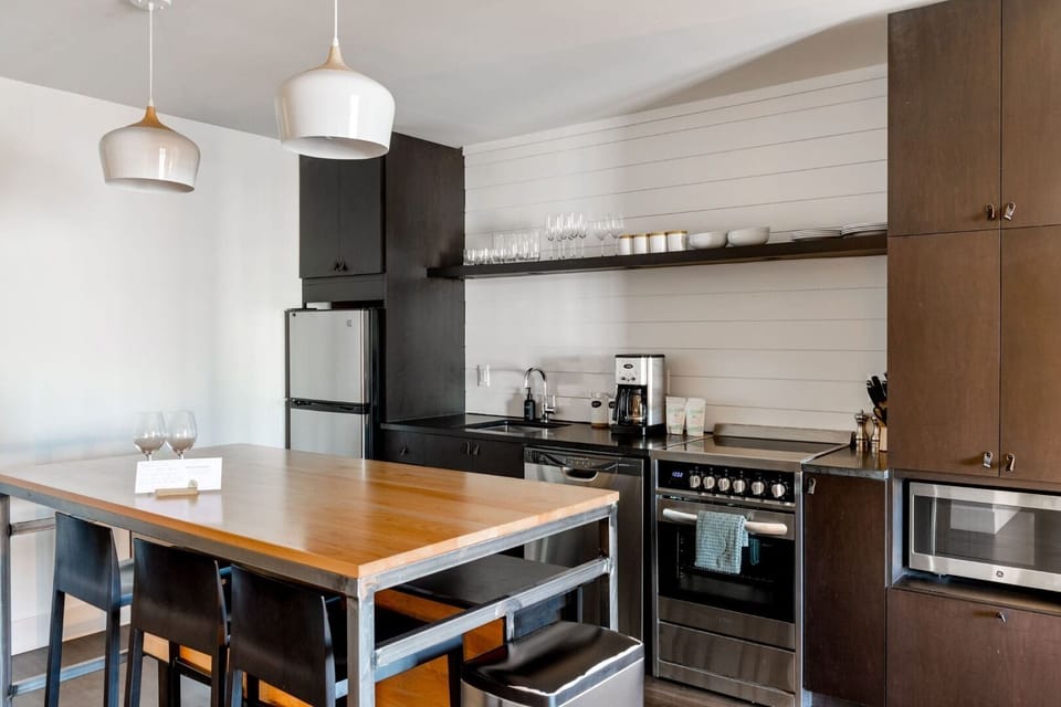Cook and gather in a stylish kitchen with modern appliances.