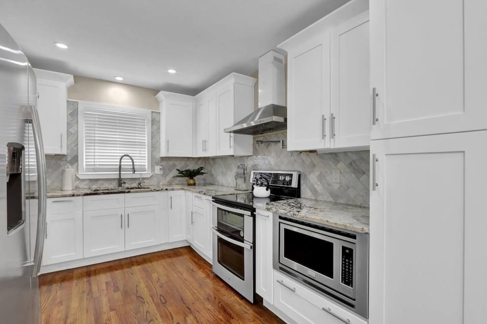 Modern, spacious kitchen area with plenty of storage. 