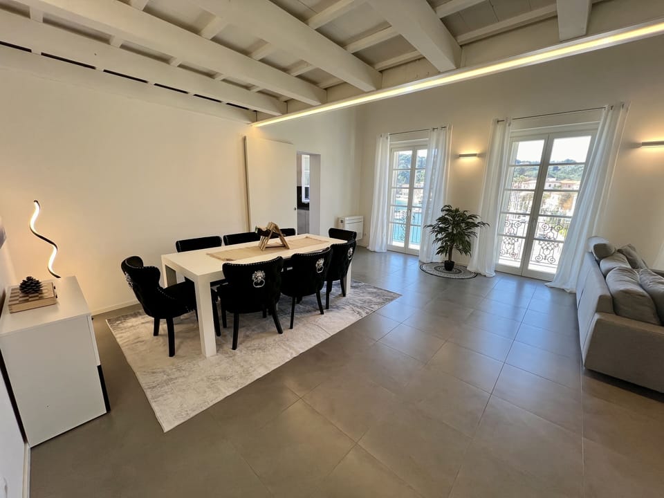 Dining room, table seats 8 with chairs for 12 and desk that doubles as a table