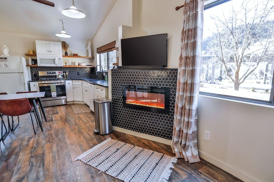 Your post-park retreat! Zen Zion Honeybee’s living room is perfect for winding down, with cushy seating, a TV, and a cozy gas fireplace.