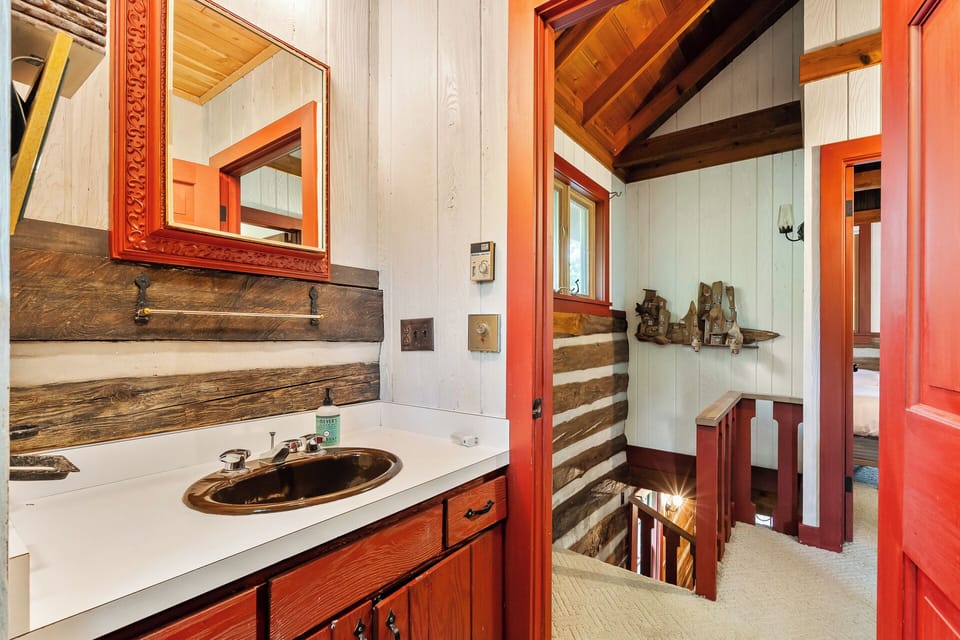Bathroom 2 (upper level) includes a walk-in shower