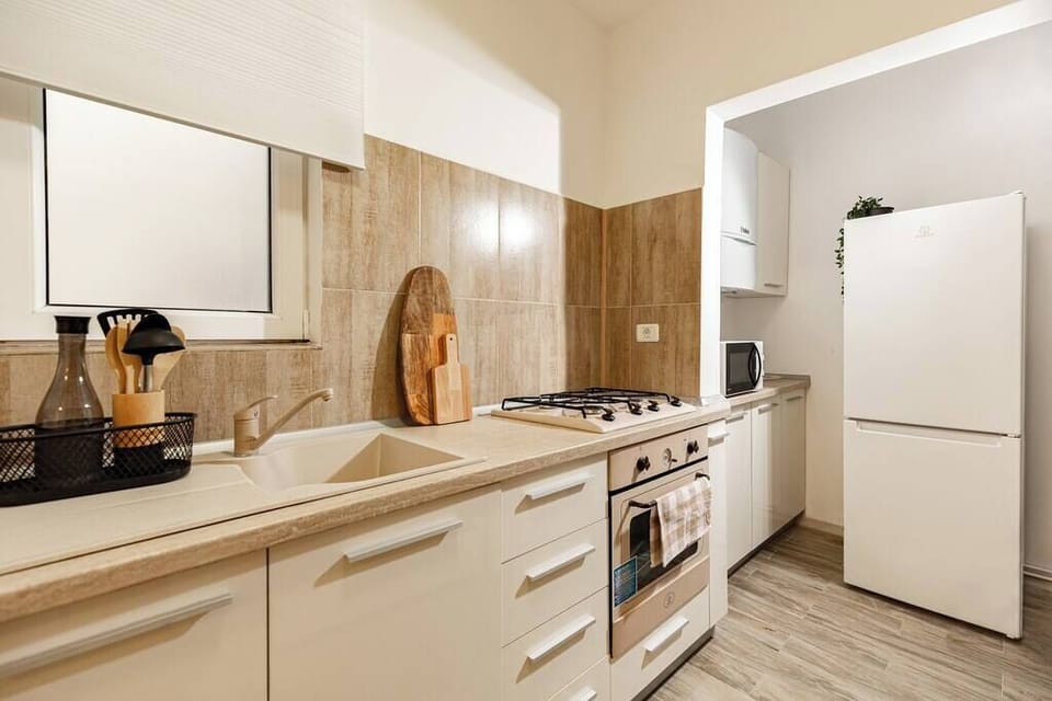 Experience the intersection of luxury and functionality in our gourmet kitchen, where sleek design meets high-end appliances for an unparalleled culinary experience.