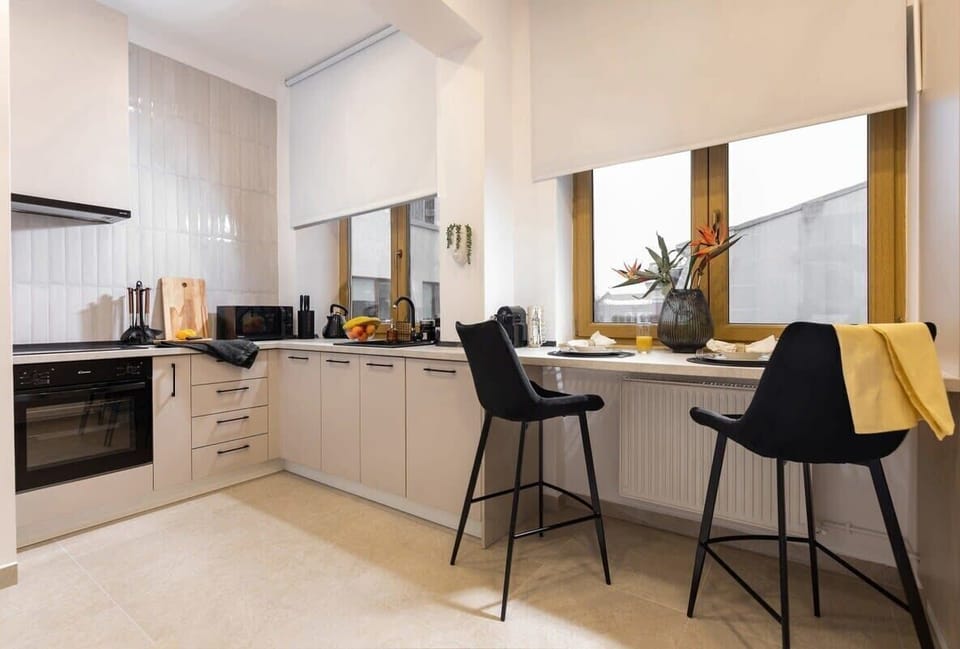 Unleash your inner chef in our meticulously outfitted kitchen, featuring state-of-the-art appliances and ample counter space for culinary creations.