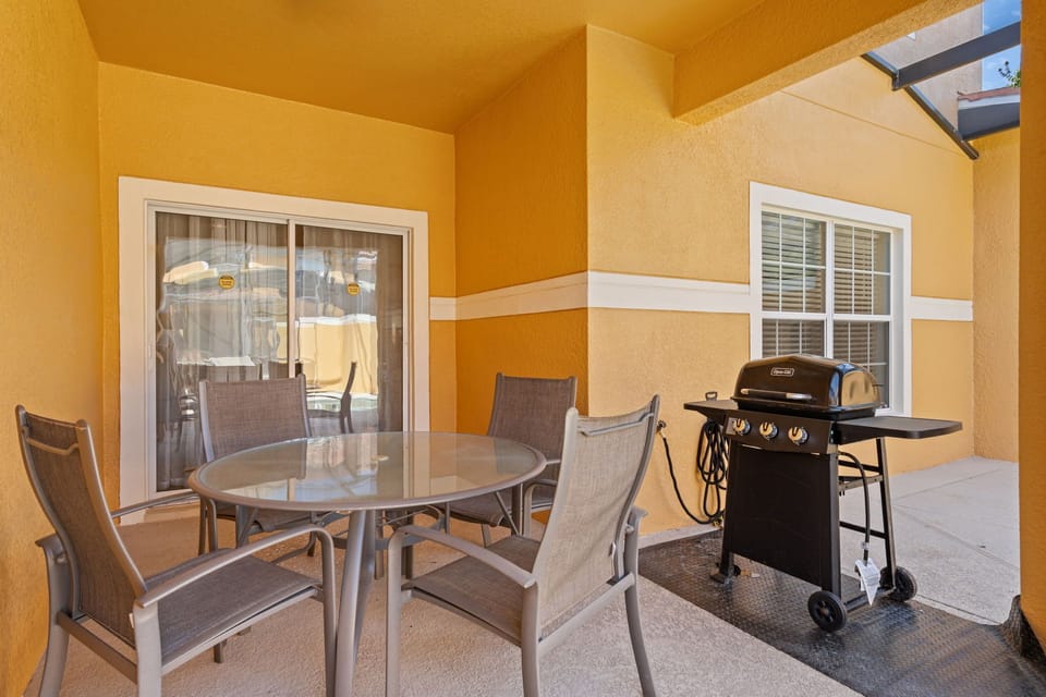Enjoy outdoor dining with our furnished patio featuring a table and chairs.