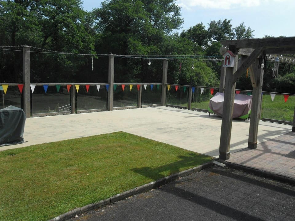 Large deck area overlooking lawns