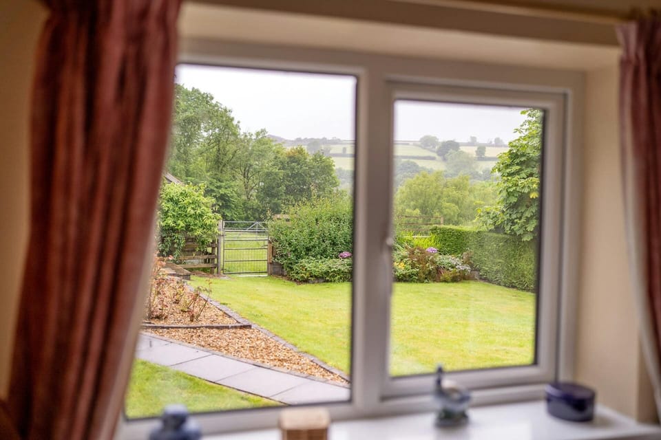 Views from the living room window over the lawned garden