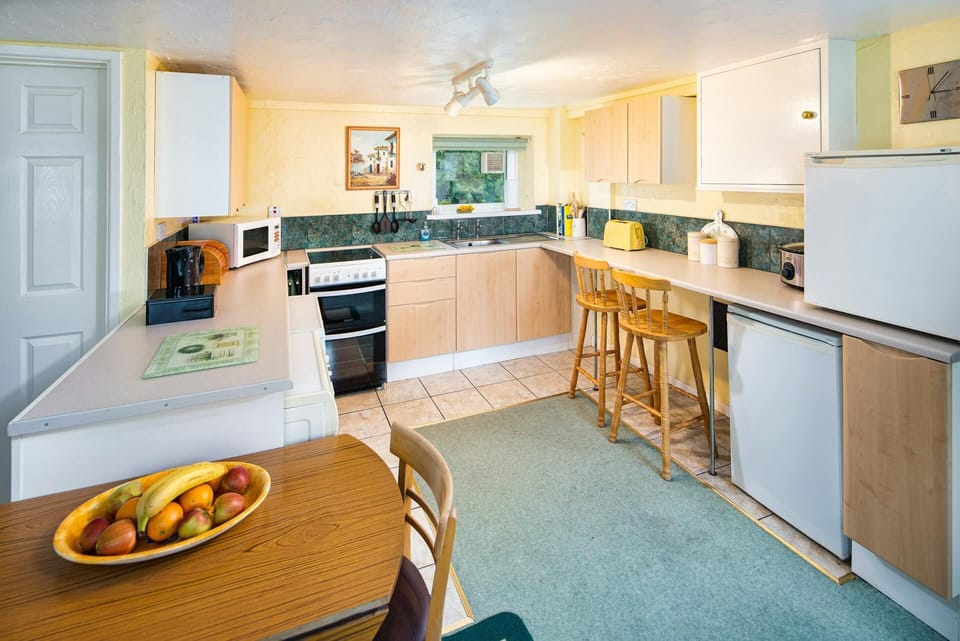 Electric cooker, fridge, microwave, kettle, toaster, washing machine, dishwasher, wall and base units and two tall bar stools
