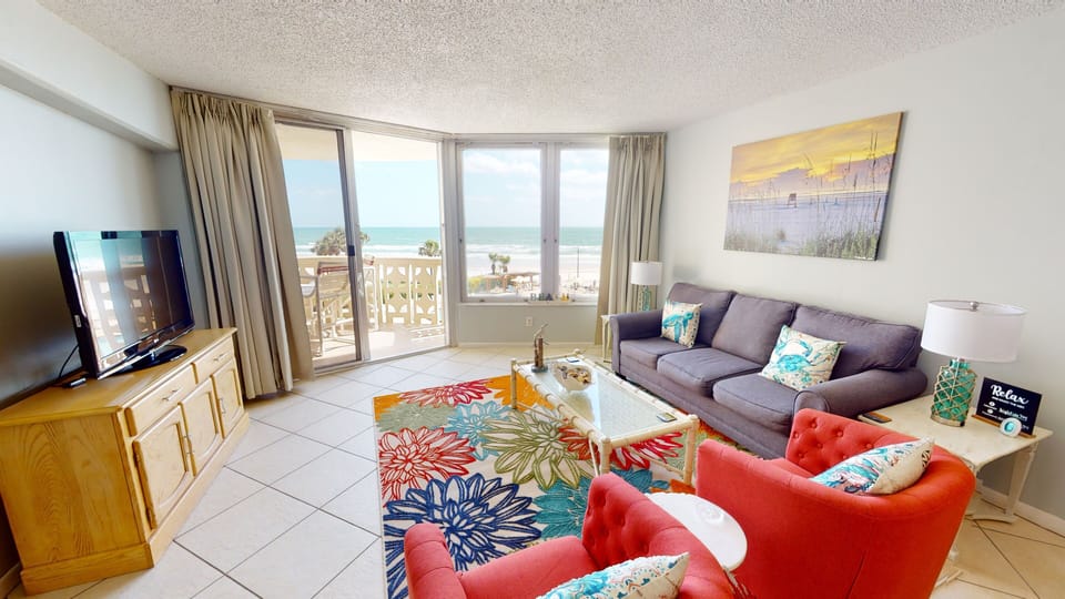 Bright and airy living room with amazing ocean views. Smart TV.