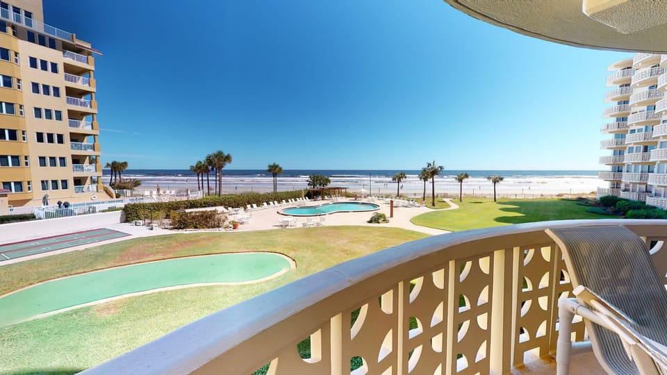 Large balcony with high top table and 4 chairs.