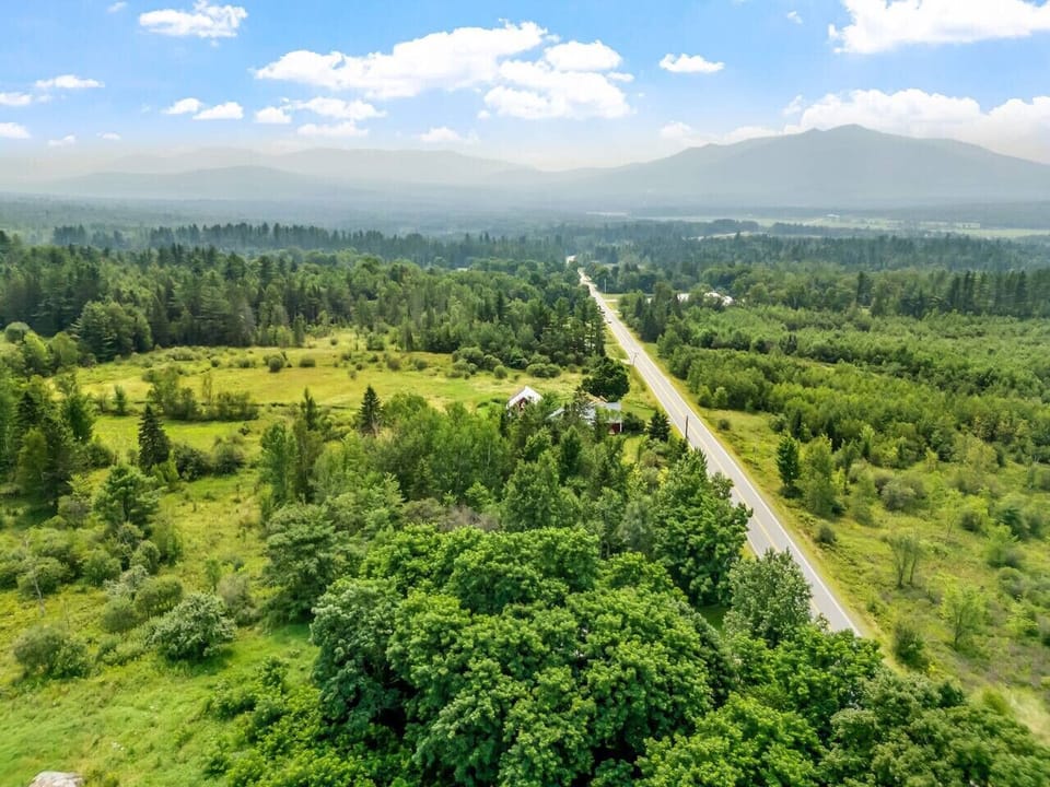 Peaceful mountain valley setting with scenic country roads and endless greenery—your quiet escape surrounded by nature