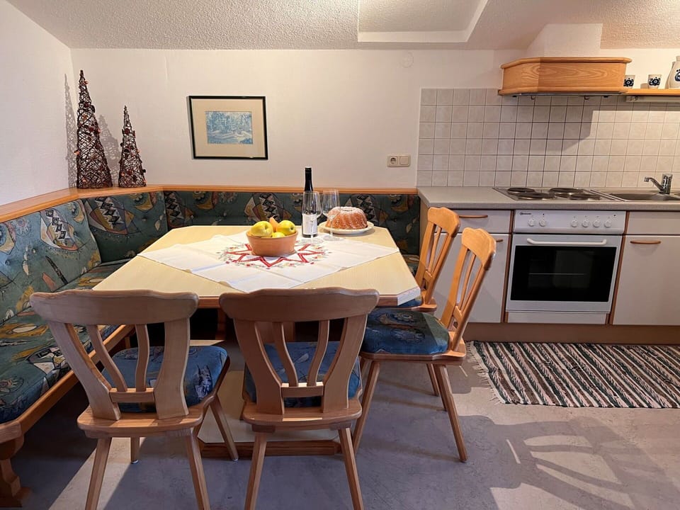 Table, Furniture, Property, Cabinetry, Wood, Countertop, Interior Design, Kitchen Appliance, Lighting, Kitchen Stove