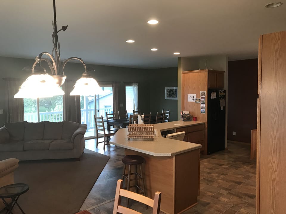 Open concept kitchen, dining and living room on top floor