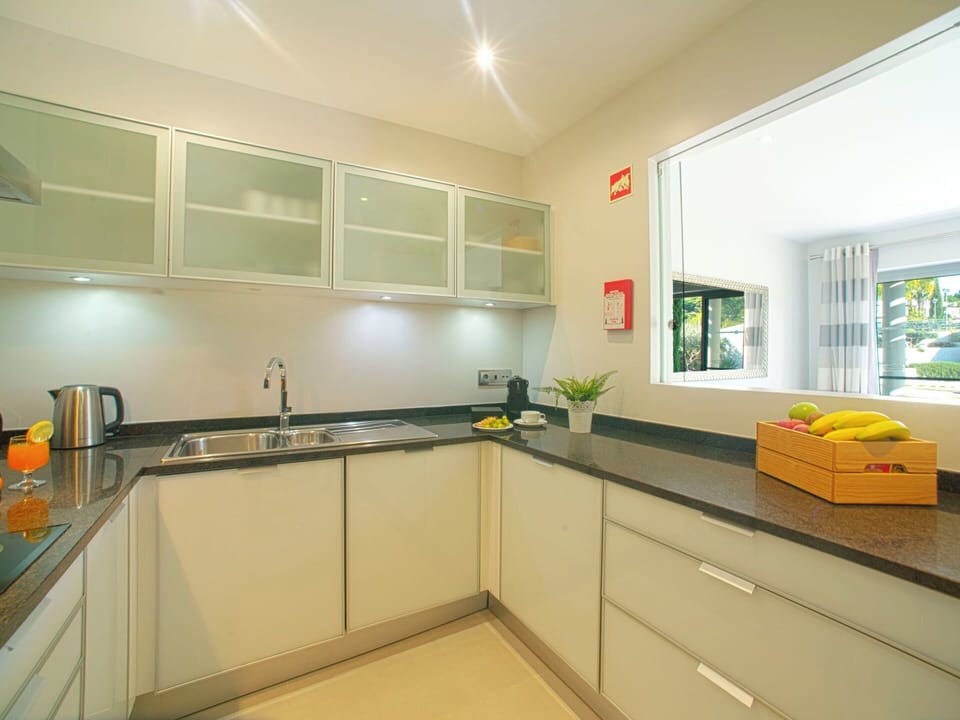 Cabinetry, Kitchen Sink, Sink, Countertop, Tap, Interior Design, Wood, Kitchen, Window, Flooring