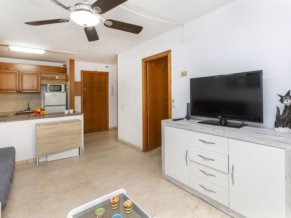 Cabinetry, Furniture, Property, Ceiling Fan, Building, Television, Drawer, Home Appliance, Door, Interior Design