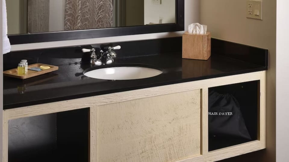 Refresh at a clean vanity with essentials ready for you.