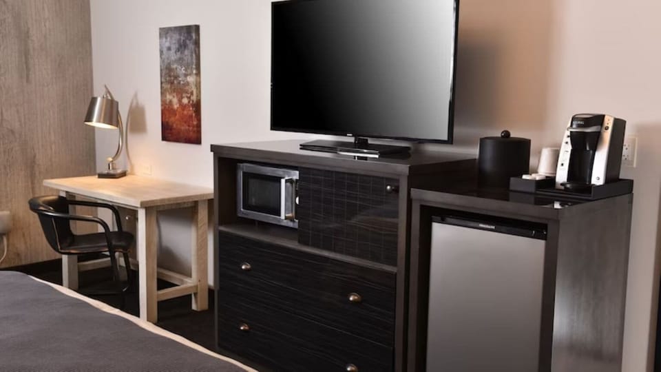 Kick back with big-screen TV, snacks, and in-room coffee.