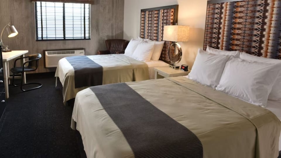 Spread out comfortably with two beds and relaxing bedside lighting.