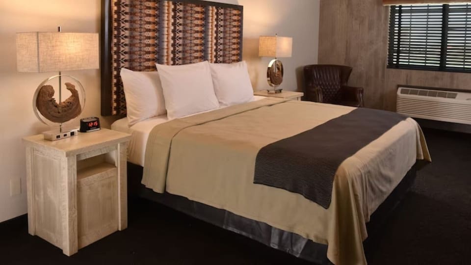 Drift off fast in a plush bed with serene, warm ambiance.
