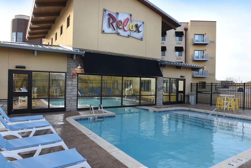 Dive into sunlit pool days with plenty of loungers.