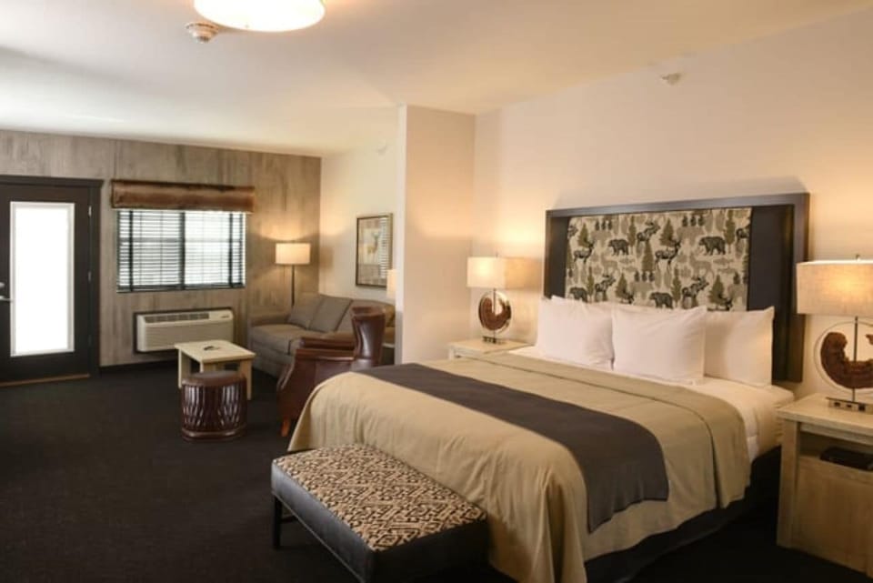 Unwind in a spacious room with cozy seating and warm light.
